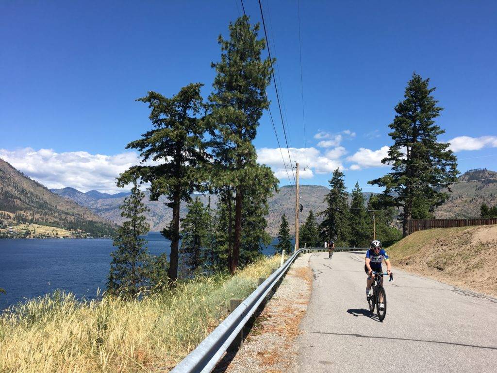 Riders climb Summit Blvd above Lake Chelan on the Manson Loop.