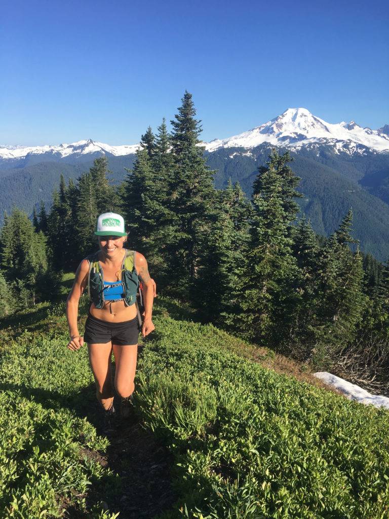 All smiles above treeline on the Church Mountain trail; Mt. Baker in the background