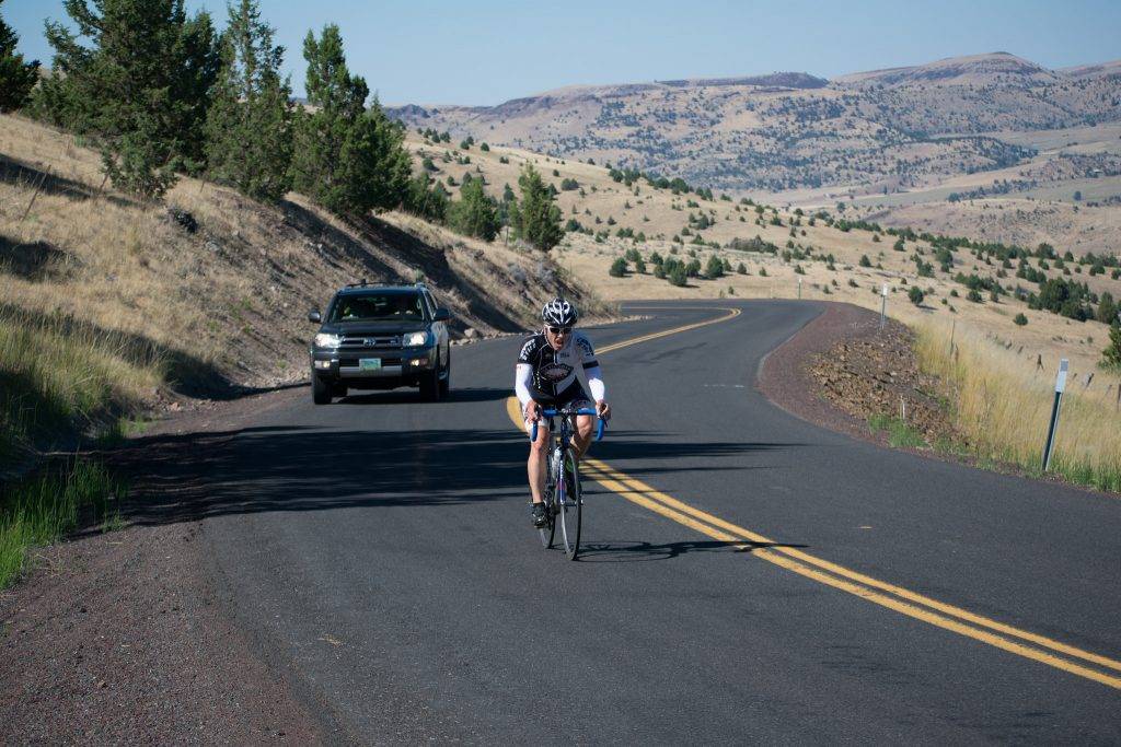 Sensity lenses at maximum darkness during an ascent of the Clarno grade in Central Oregon during Race Across Oregon 2018. Credit: Zach Goodin, .RAWyeti Images