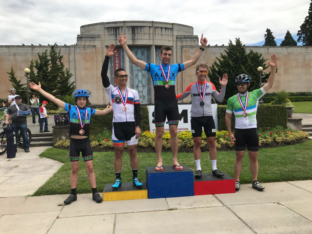One of these is not like the others: Adrian on the podium at the 2017 Volunteer Park Criterium.