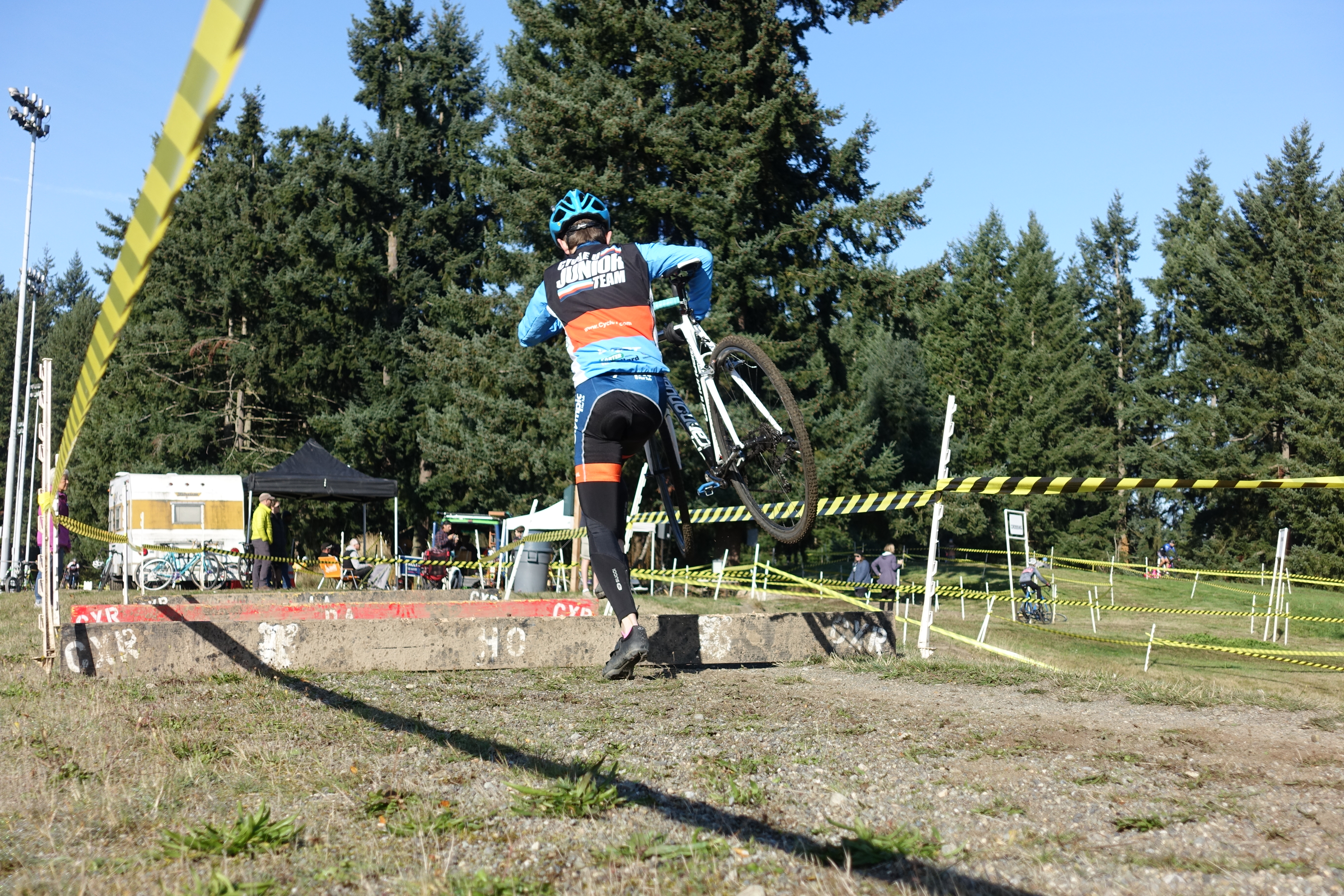 A RAD Racing p/b Cycle U competitor clears the barriers near "Hodala Corner."