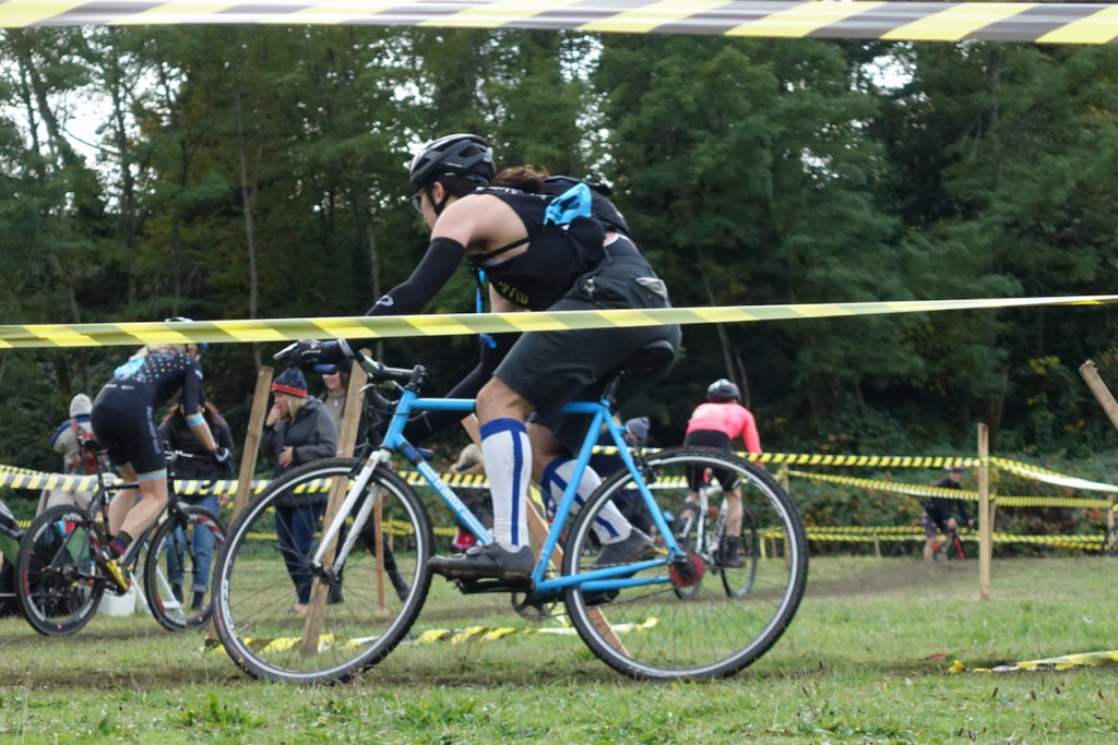 Riders weaving through a zig-zag section on the lower part of the course.