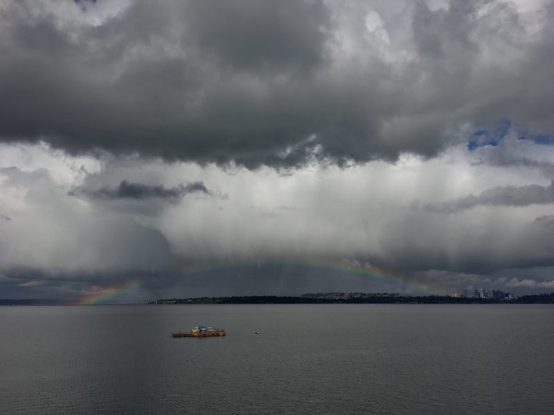 Life at the speed of bike: Spectacular clouds looked as though they were trying to "flatten the curve" of this rainbow above Lake Washington