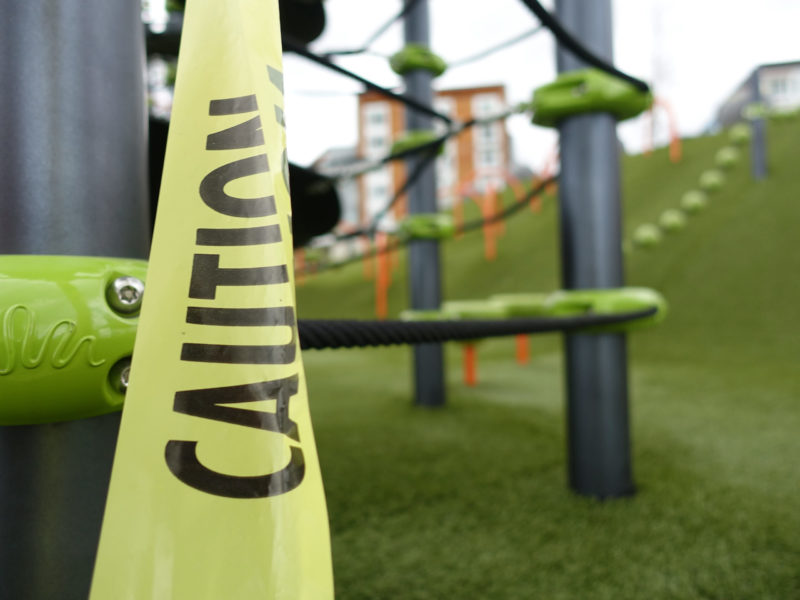 Seattle parks are closed: Caution tape at the new-ish playground in the Yesler Terrace neighborhood.