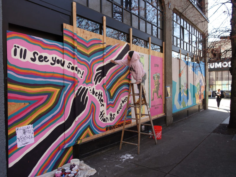 Artist at work on Pike St: "i'll see you soon! better than it's ever been"